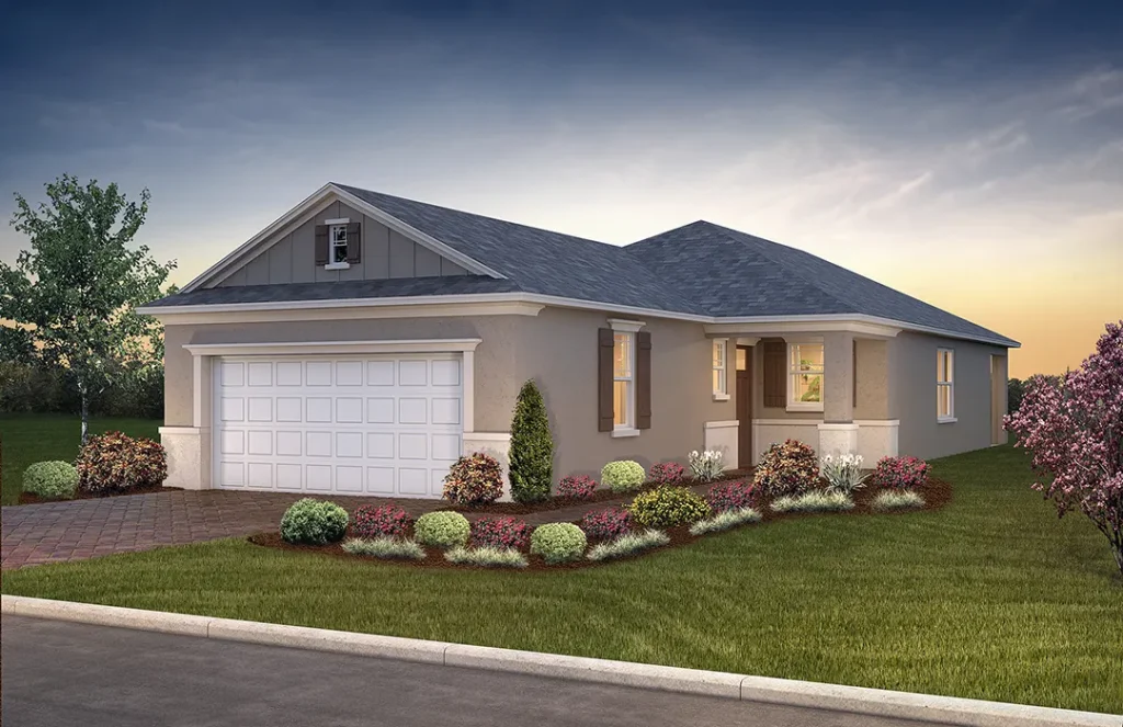 Exterior rendering of the Terra home model: single-story gray-tan stucco house with a gray shingle gable roof over the two-car white garage, brown shuttered windows, a covered front entry with column, brick-paver driveway and walkway, and colorful shrub and flower landscaping at sunset.